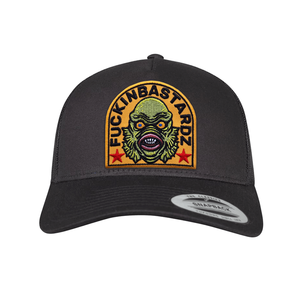 Creature of the Lagoon trucker cap featuring an embroidered design and a stylish black finish.