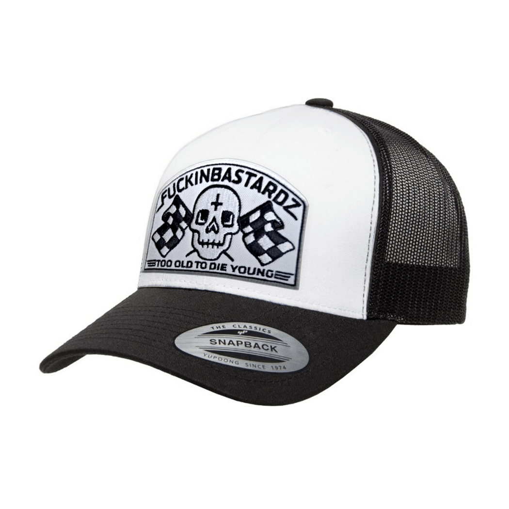 Die Old Trucker cap with embroidered patch featuring skull and checkered flags, stylish snapback design.