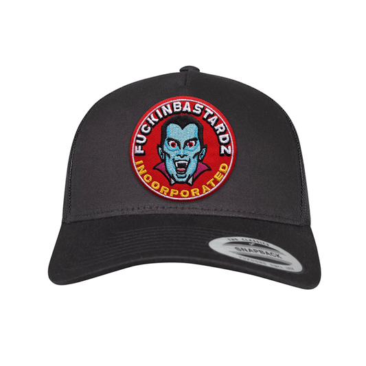 Dracula trucker cap with embroidered patch featuring a vampire design and statement, black snapback style.