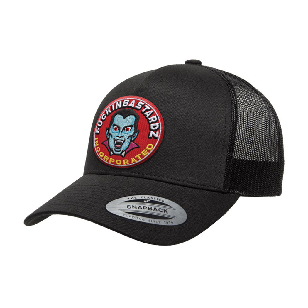 Dracula trucker cap with embroidered patch featuring a colorful vampire design on a black snapback.