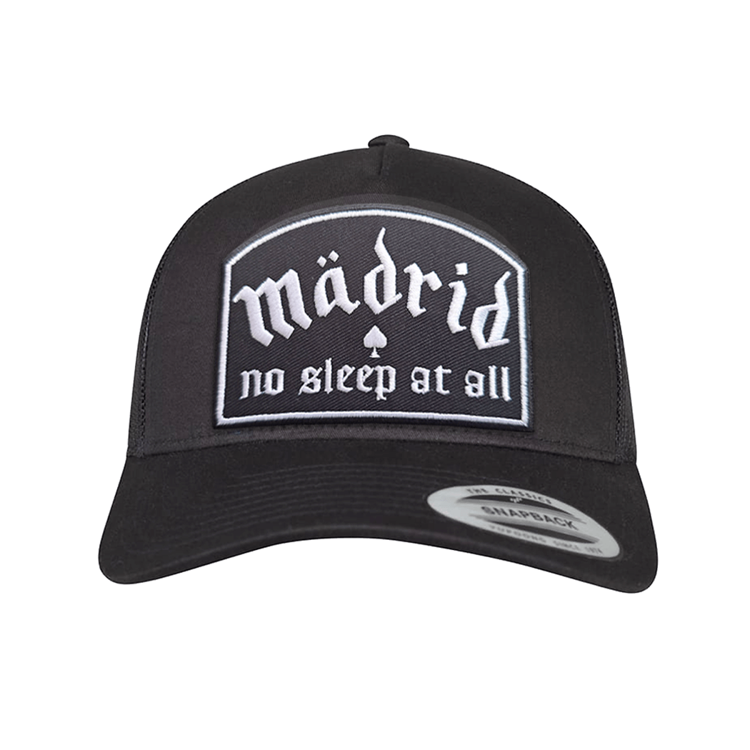 Madrid No Sleep trucker cap with embroidered patch displaying the text 'madrid no sleep at all' on a black background.