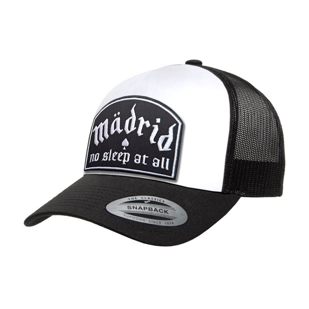 Madrid No Sleep trucker cap in black and white with embroidered patch and adjustable snapback closure.