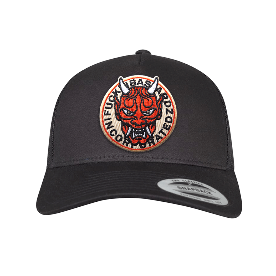 Yakuza trucker cap featuring a bold embroidered patch of a devil design on a black background.