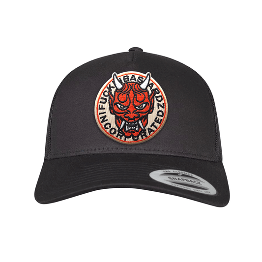 Yakuza trucker cap featuring a bold embroidered patch of a devil design on a black background.