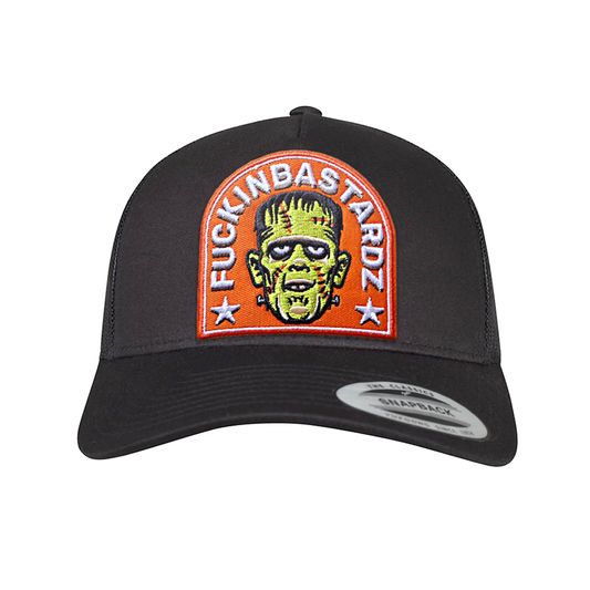 Frankie trucker cap with embroidered Frankenstein patch and adjustable snapback closure.