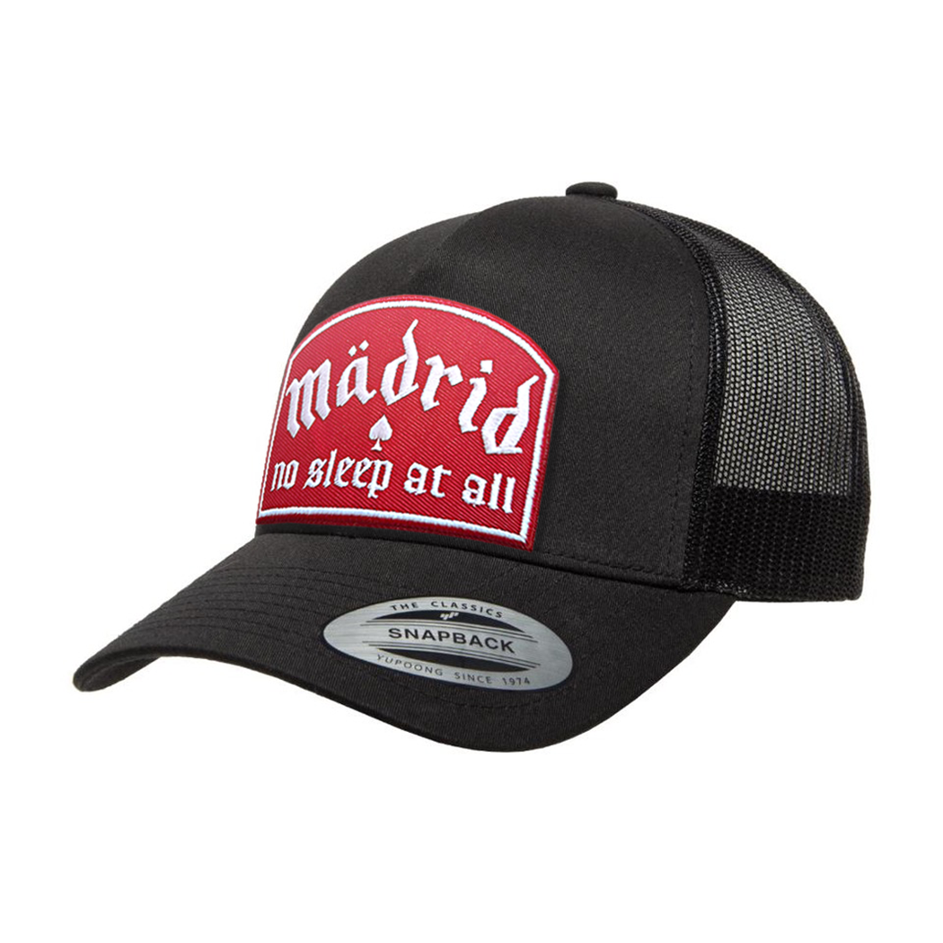 Madrid No Sleep Red trucker cap with embroidered patch, black mesh back and adjustable snapback closure.